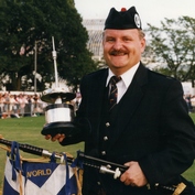 The outgoing Pipe Major, Robert Mathieson with one of 5 World Pipe Band Championship wins